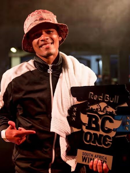Bboy Meaty holding Red Bull BC One South Africa Winner trophy